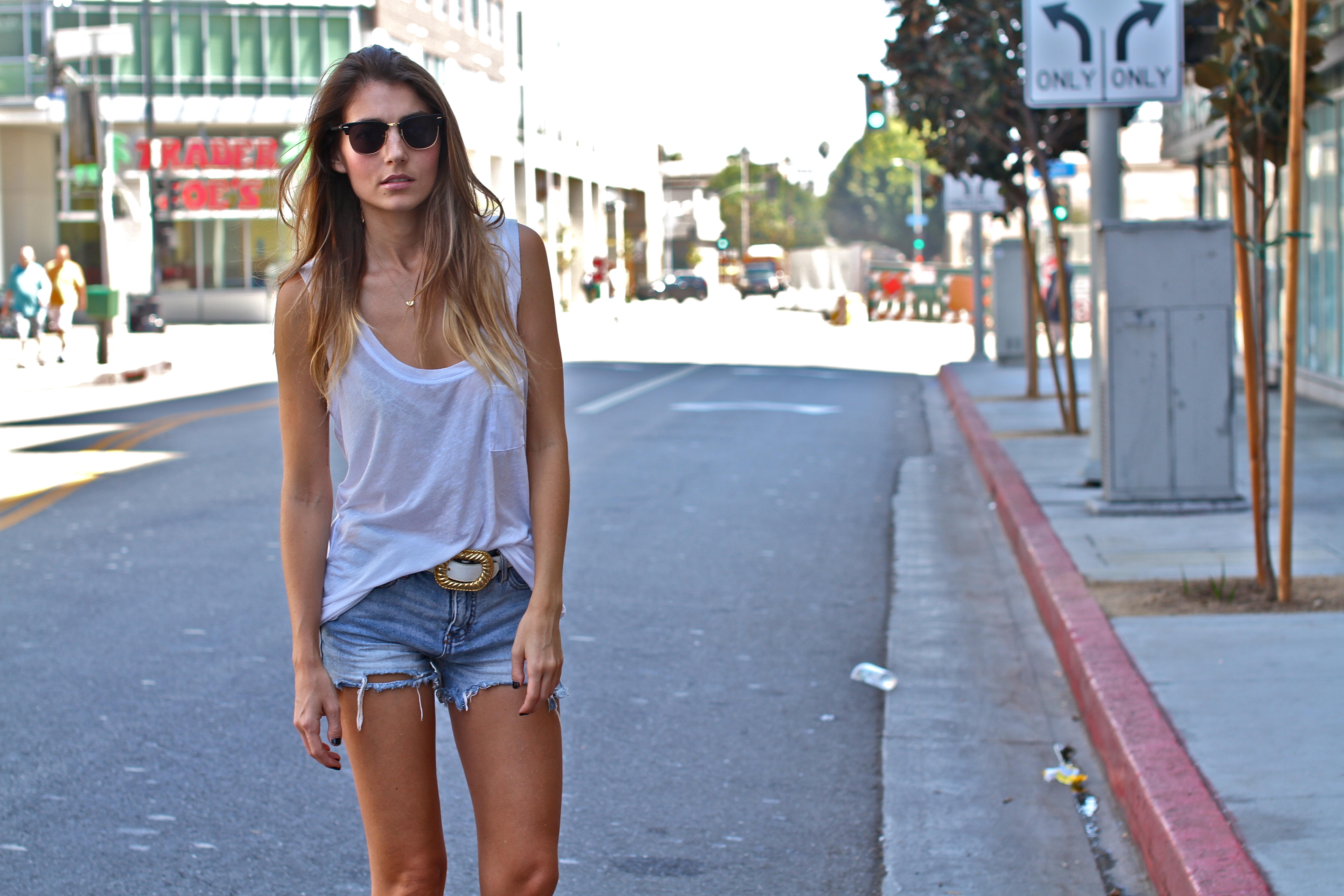 white top and denim shorts